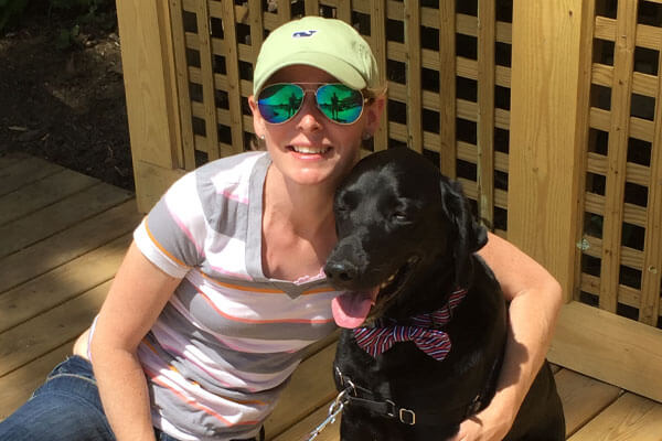Person and their dog outside.