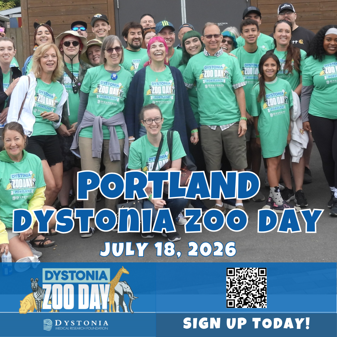 Group of participants wearing teal event shirts posing for a group photo at Portland Dystonia Zoo Day 2026, with a large blue event banner and a QR code at the bottom.