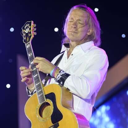 Musician playing his guitar.
