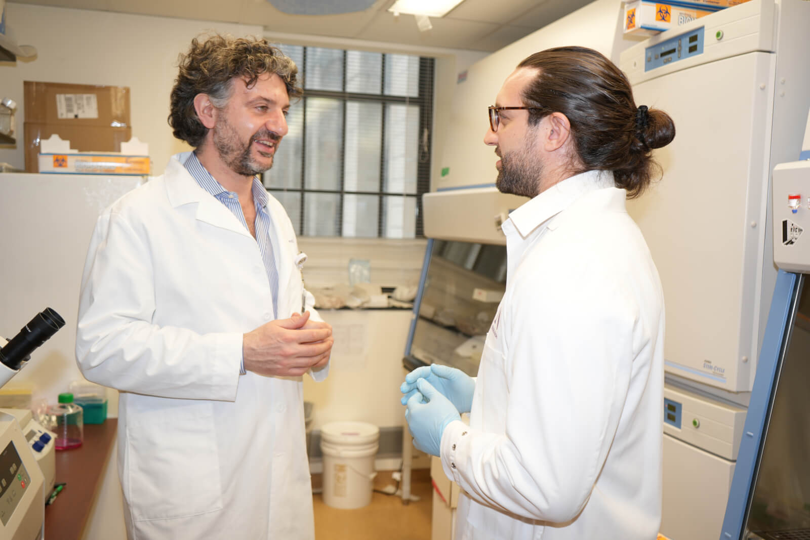 scientists talking in lab